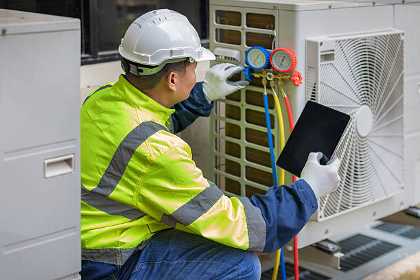 Professional Heat Pump Repair technician working in Buda, TX